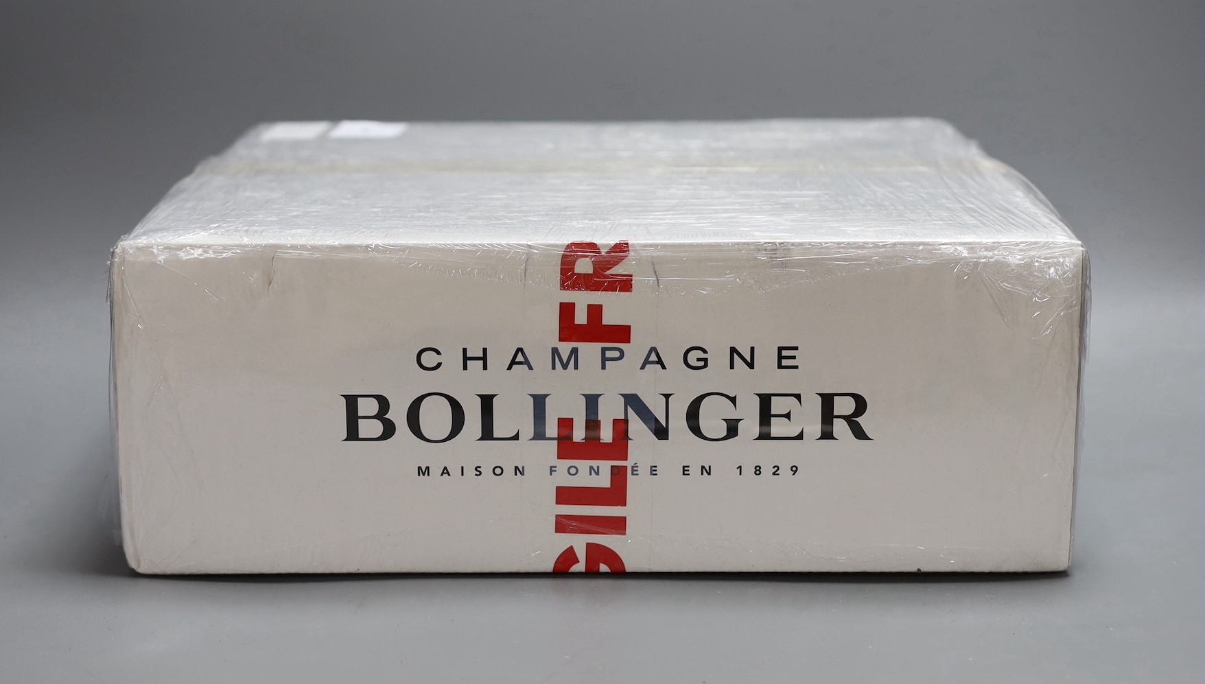 A boxed Champagne Bollinger Grand Annee 2002 James Bond presentation pack, each bottle in it's own lockable gun/ammo case.